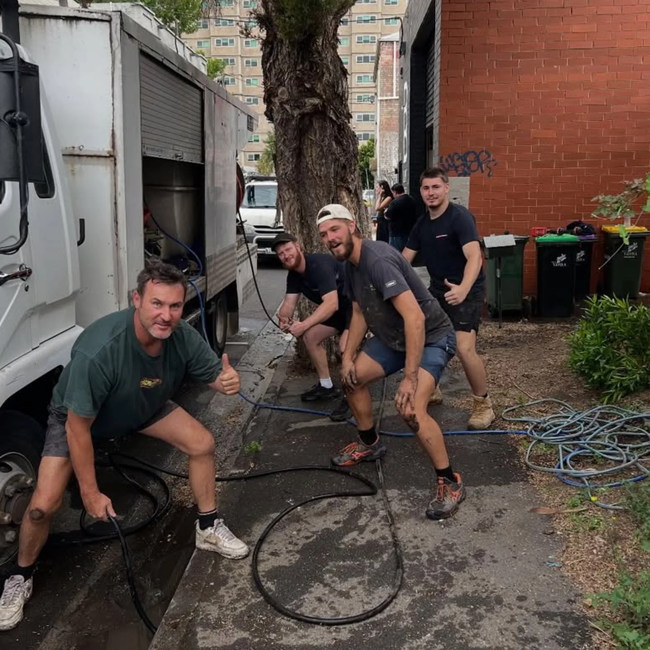 plumber fixing pipe under sink